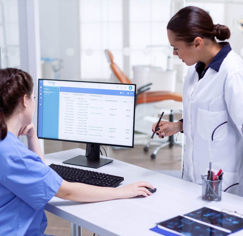 Doctor at worlstation Hospital IT staff reviewing security alerts